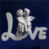 estatuilla de amor ángel